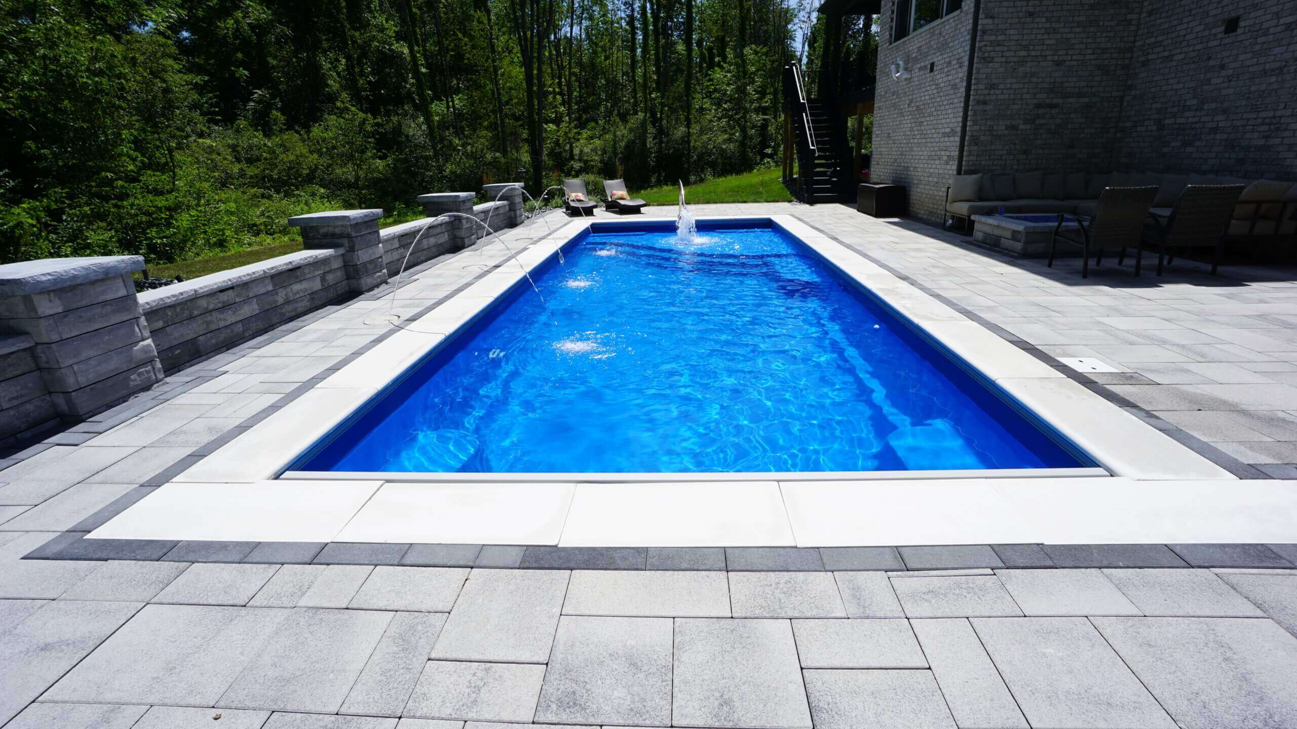 Fiberglass pool interior color options in blue and teal tones