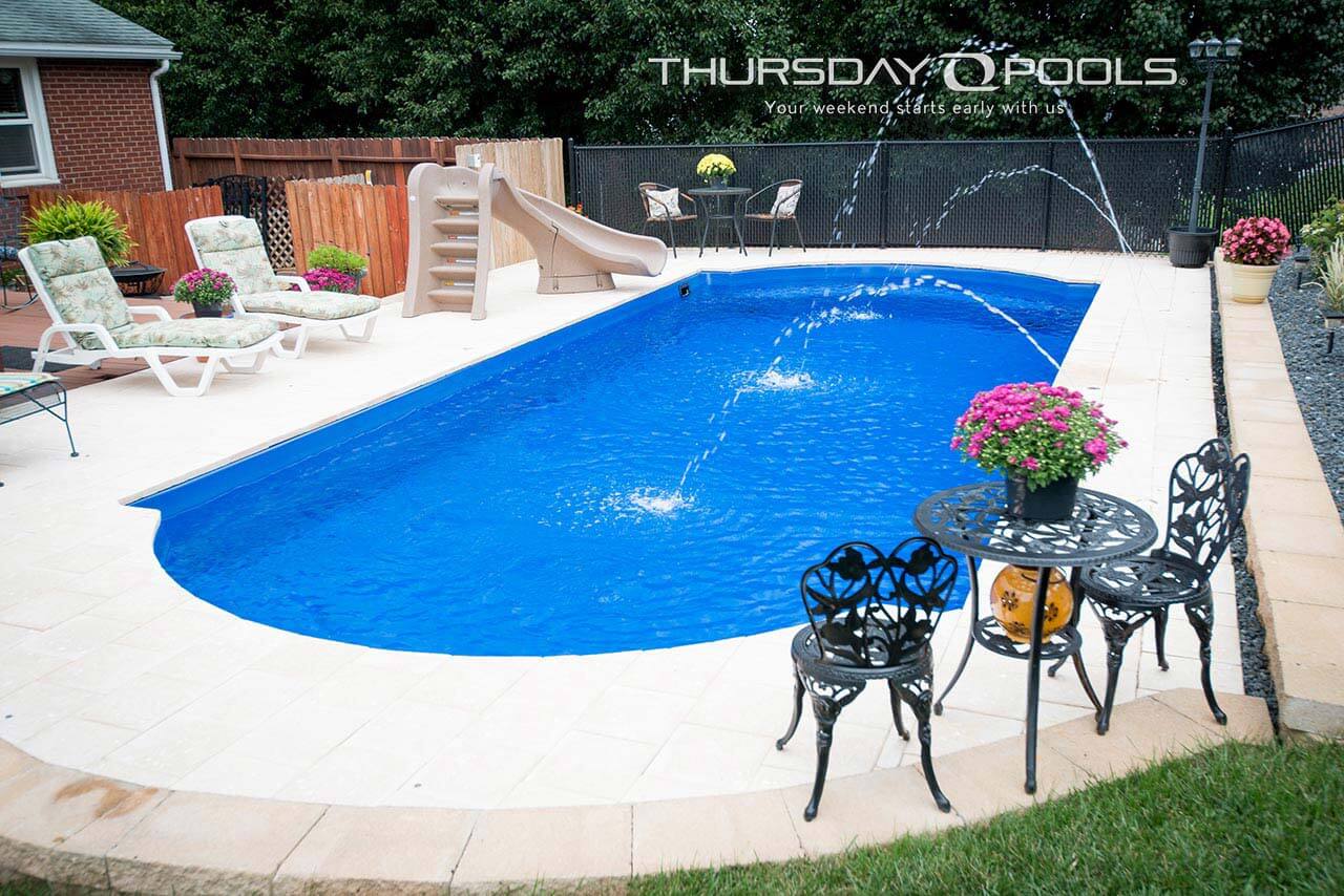 Installed Cathedral fiberglass pool with slide, deck jets and paver deck