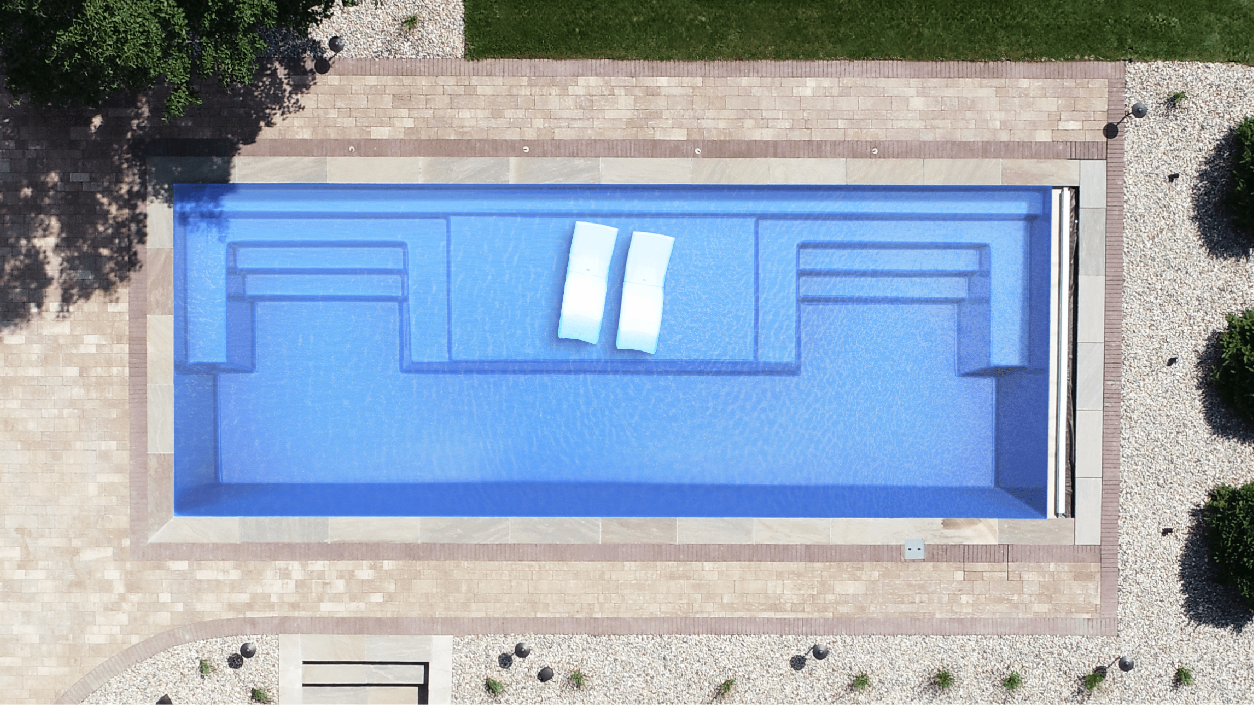 Installed Magnate fiberglass pool, auto-cover ready, seen from above