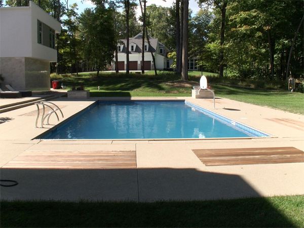 Vinyl liner inground pool with diving board, seen from above