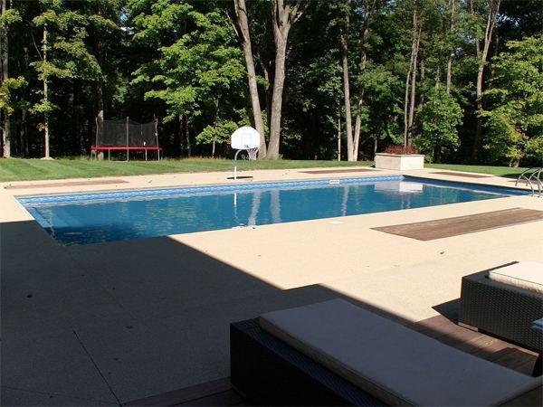 Vinyl liner inground pool with diving board, seen from above