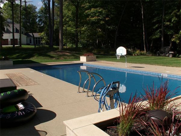 Vinyl liner inground pool with diving board, seen from above