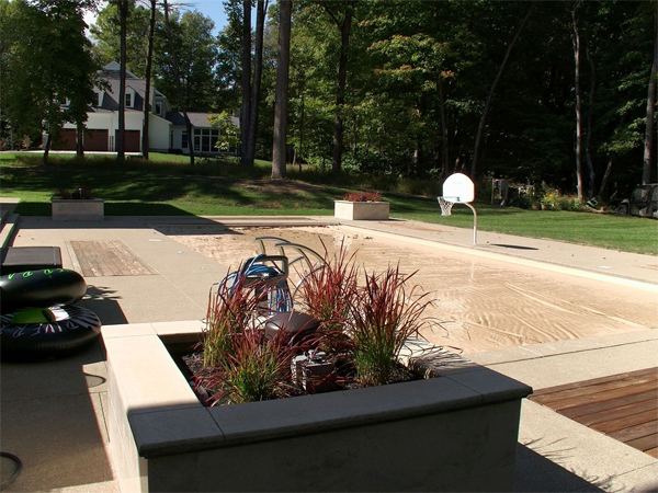 Vinyl liner inground pool with diving board, seen from above