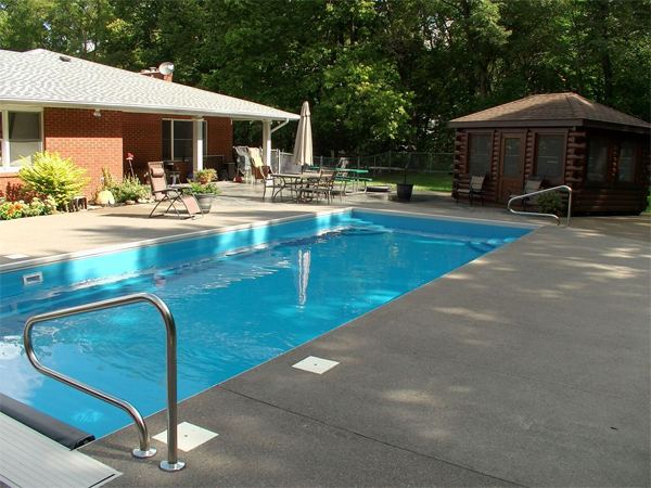 Inground fiberglass swimming pool in a Central Ohio backyard by The Pool People of Ohio