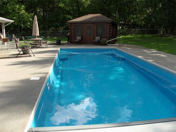 Inground fiberglass swimming pool in a Central Ohio backyard by The Pool People of Ohio