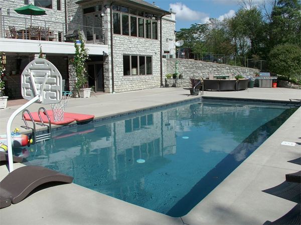 Inground fiberglass swimming pool in a Central Ohio backyard by The Pool People of Ohio