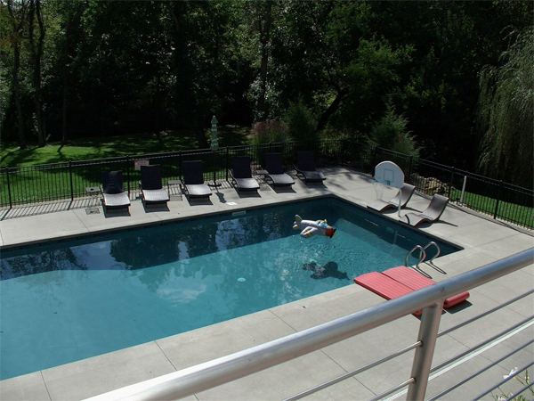 Inground fiberglass swimming pool in a Central Ohio backyard by The Pool People of Ohio