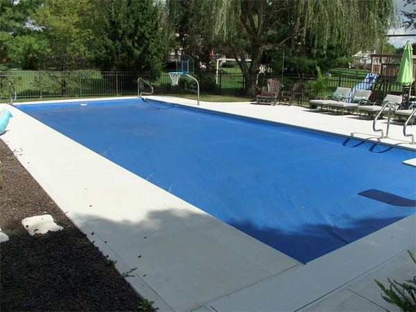 Inground fiberglass swimming pool in a Central Ohio backyard by The Pool People of Ohio