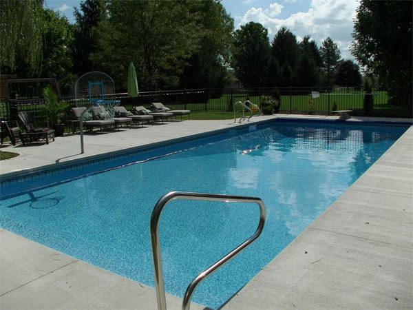 Inground fiberglass swimming pool in a Central Ohio backyard by The Pool People of Ohio