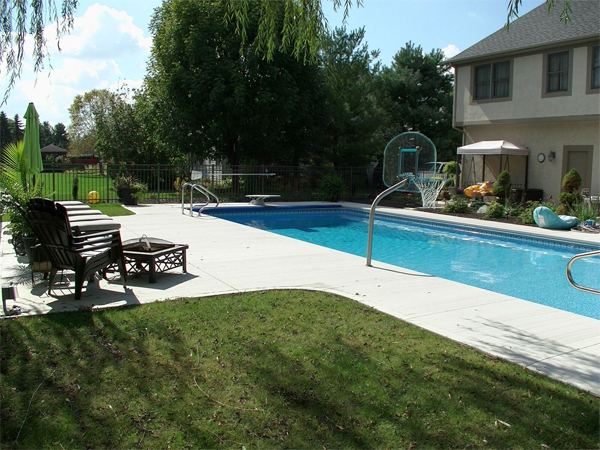 Inground fiberglass swimming pool in a Central Ohio backyard by The Pool People of Ohio