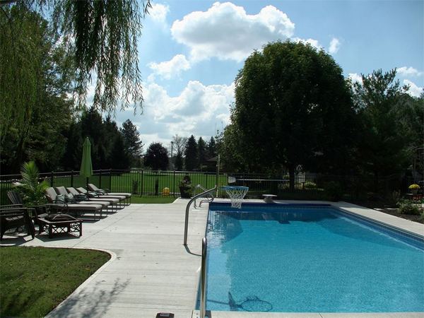 Inground fiberglass swimming pool in a Central Ohio backyard by The Pool People of Ohio