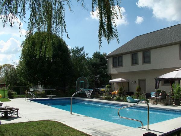 Inground fiberglass swimming pool in a Central Ohio backyard by The Pool People of Ohio