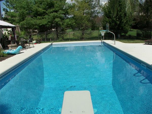 Inground fiberglass swimming pool in a Central Ohio backyard by The Pool People of Ohio