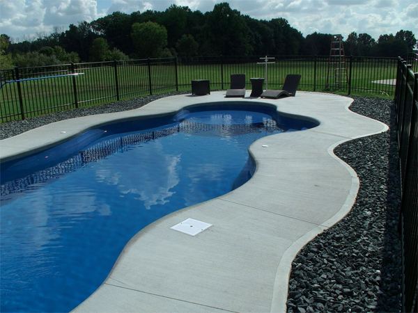 Inground fiberglass swimming pool in a Central Ohio backyard by The Pool People of Ohio