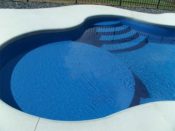 Inground fiberglass swimming pool in a Central Ohio backyard by The Pool People of Ohio
