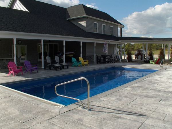 Inground fiberglass swimming pool in a Central Ohio backyard by The Pool People of Ohio