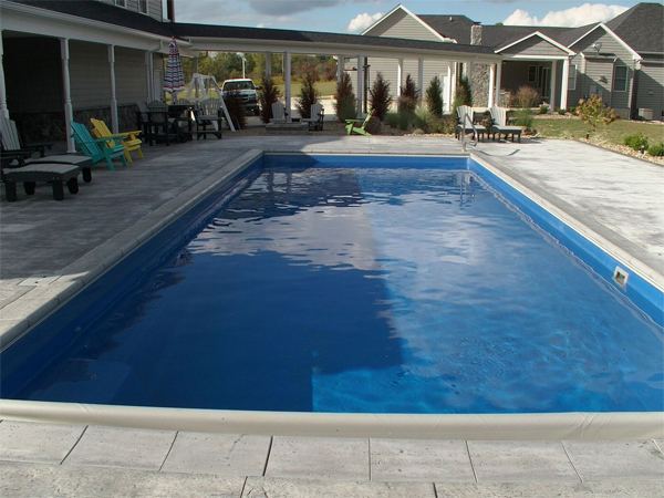 Inground fiberglass swimming pool in a Central Ohio backyard by The Pool People of Ohio