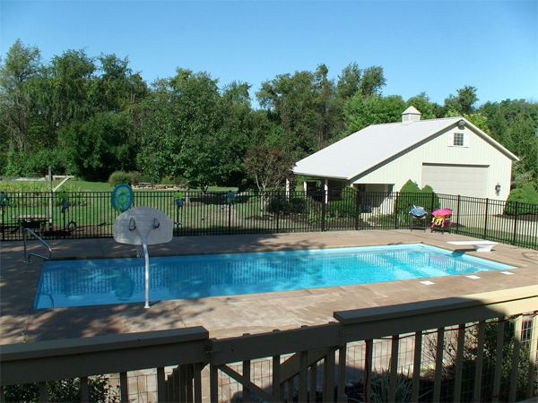 Inground fiberglass swimming pool in a Central Ohio backyard by The Pool People of Ohio