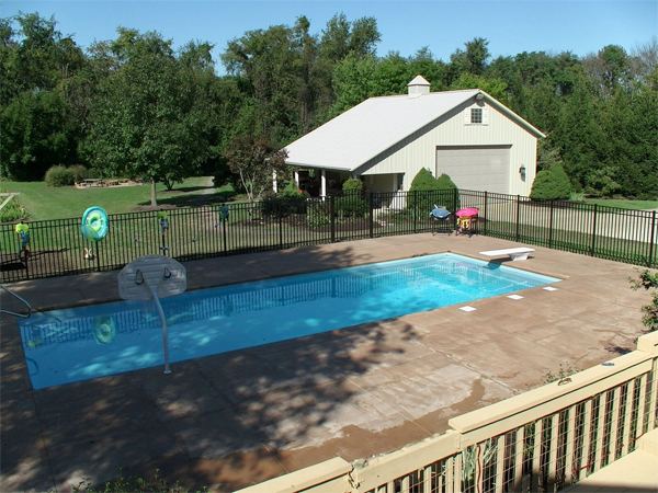 Inground fiberglass swimming pool in a Central Ohio backyard by The Pool People of Ohio