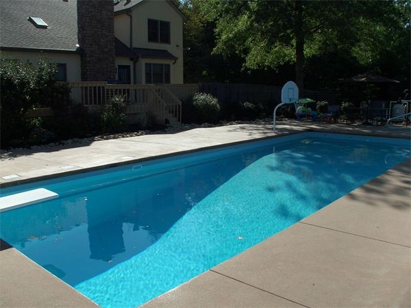 Inground fiberglass swimming pool in a Central Ohio backyard by The Pool People of Ohio