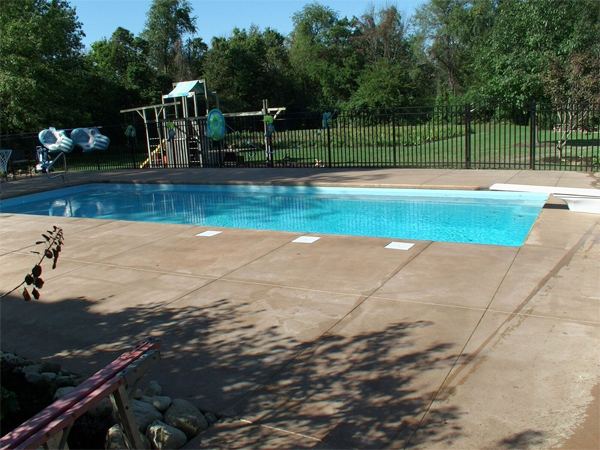 Inground fiberglass swimming pool in a Central Ohio backyard by The Pool People of Ohio