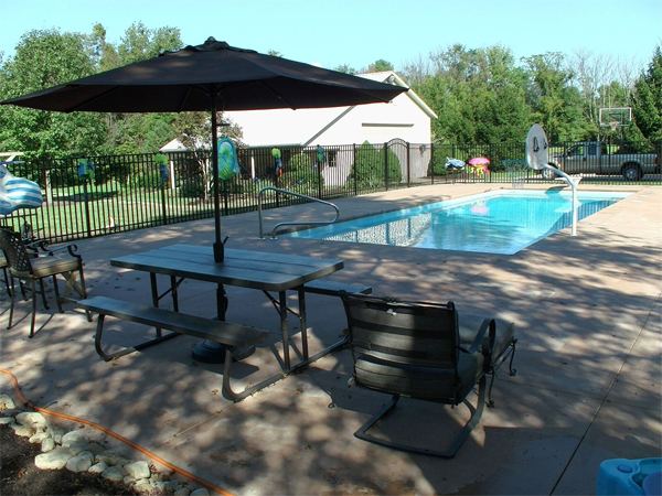 Inground fiberglass swimming pool in a Central Ohio backyard by The Pool People of Ohio