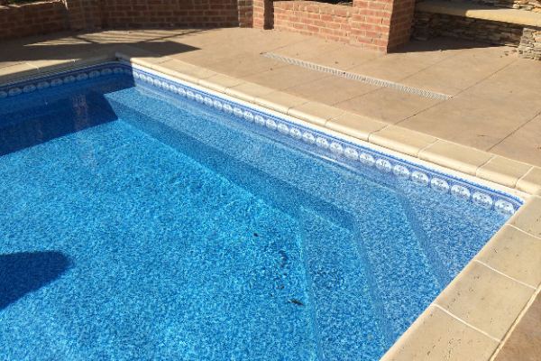 Inground fiberglass swimming pool in a Central Ohio backyard by The Pool People of Ohio