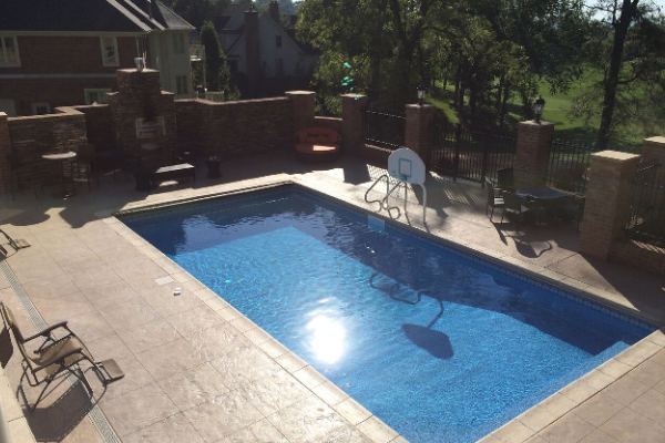 Inground fiberglass swimming pool in a Central Ohio backyard by The Pool People of Ohio
