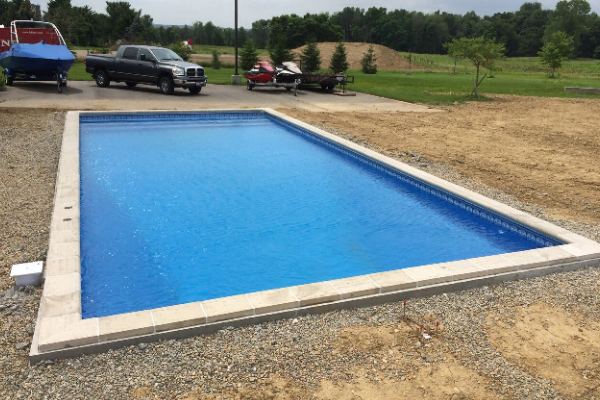 Inground fiberglass swimming pool in a Central Ohio backyard by The Pool People of Ohio