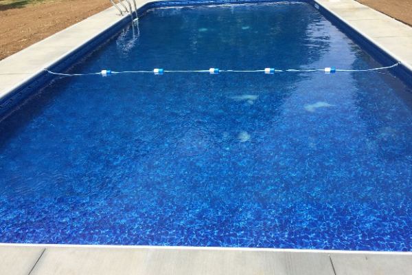 Inground fiberglass swimming pool in a Central Ohio backyard by The Pool People of Ohio