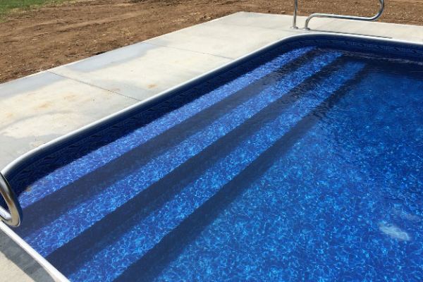 Inground fiberglass swimming pool in a Central Ohio backyard by The Pool People of Ohio