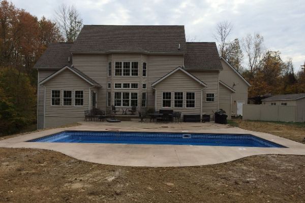 Inground fiberglass swimming pool in a Central Ohio backyard by The Pool People of Ohio