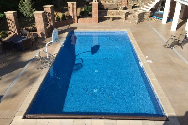 Inground fiberglass swimming pool in a Central Ohio backyard by The Pool People of Ohio