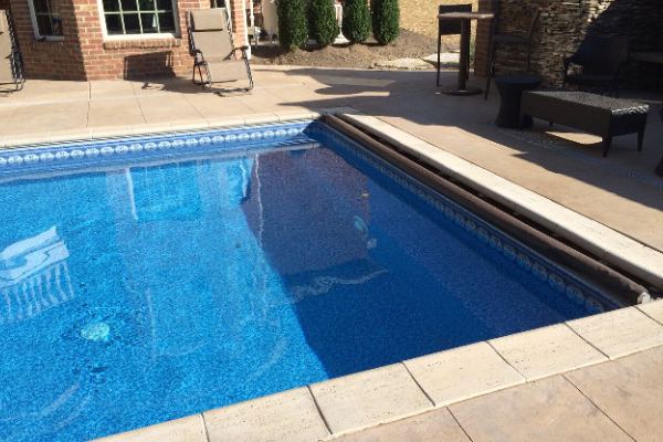 Inground fiberglass swimming pool in a Central Ohio backyard by The Pool People of Ohio